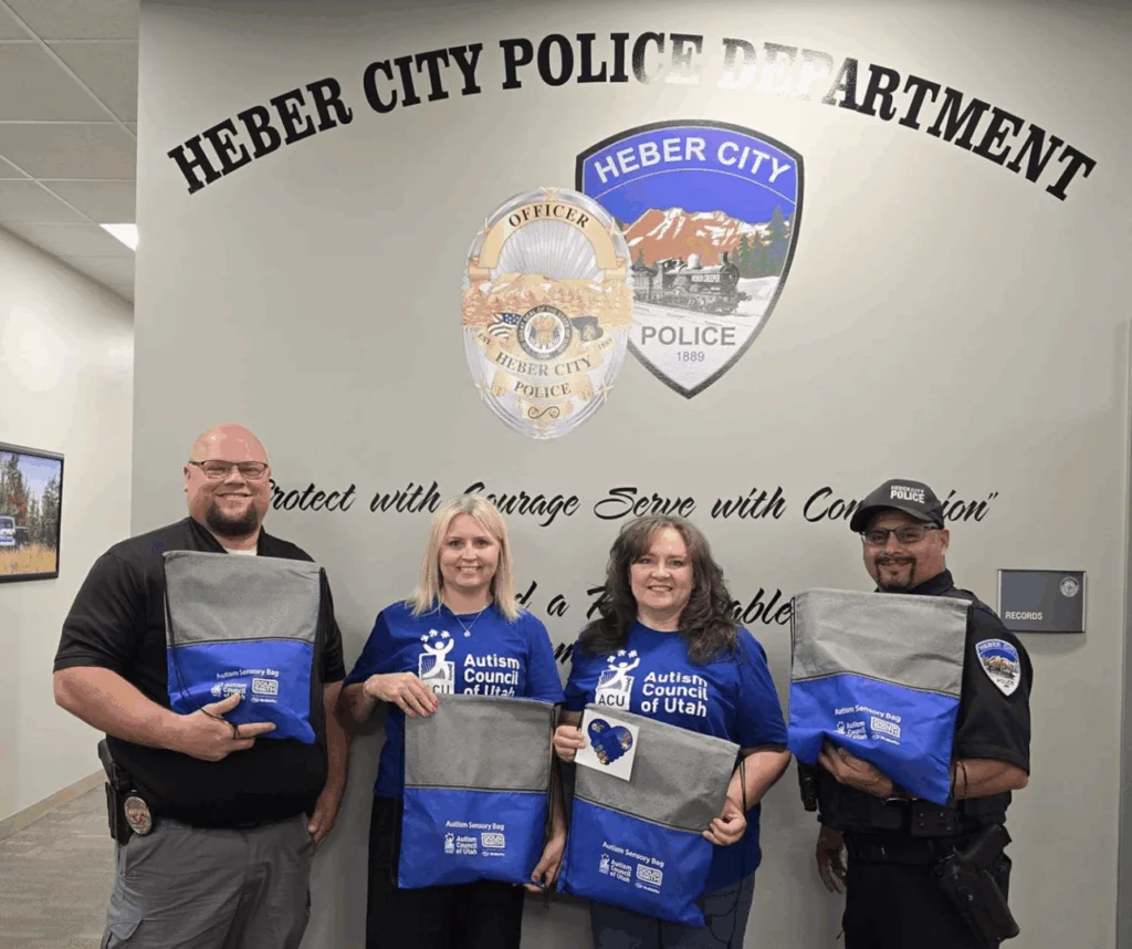 Members from the Autism Council of Utah presenting packages to the Heber City Police Department