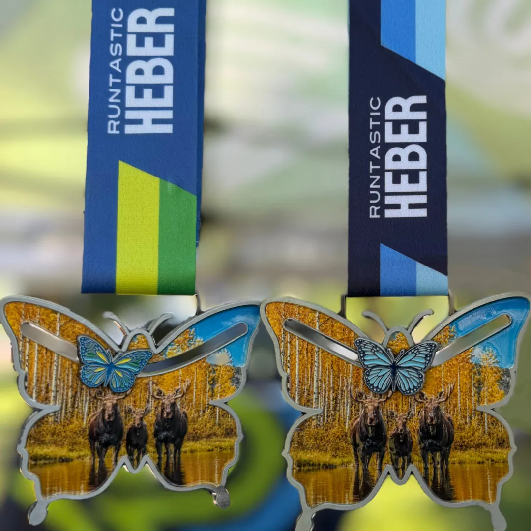 Runtastic HEBER 2026 Finisher Medals Runtastic HEBER 2026 Finisher Medals with 3 moose standing in front of aspen trees with a butterfly that can move across the front